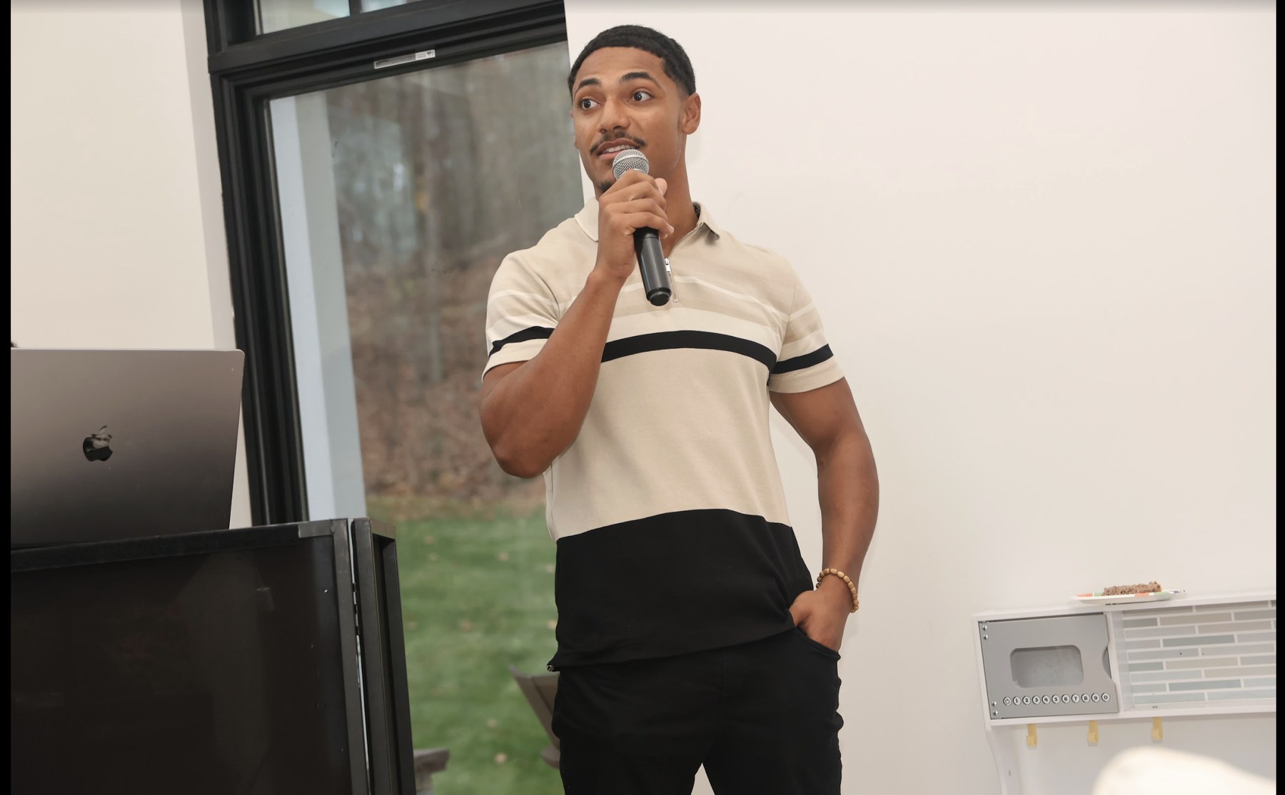 Elijah Naylor Jr. speaking to a group about health and wellness
